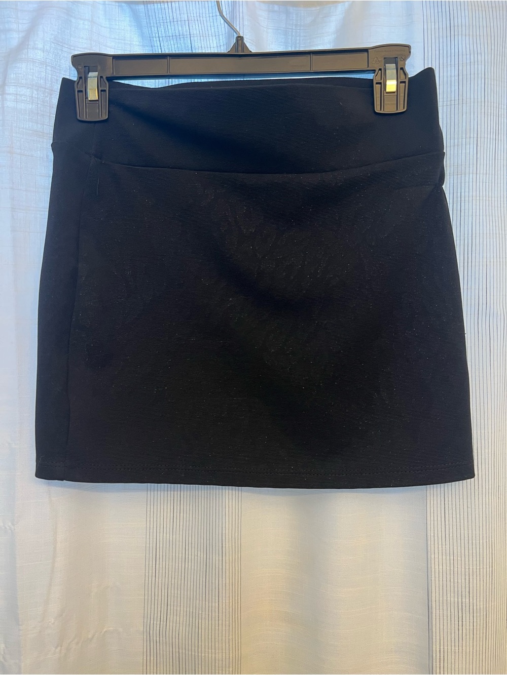 Black mini skirt with subtle glittery leopard textured pattern